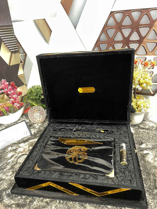 Luxurious black velvet Quran set with decorative box, wooden Rhal, bookmark, tasbeeh, and attar.